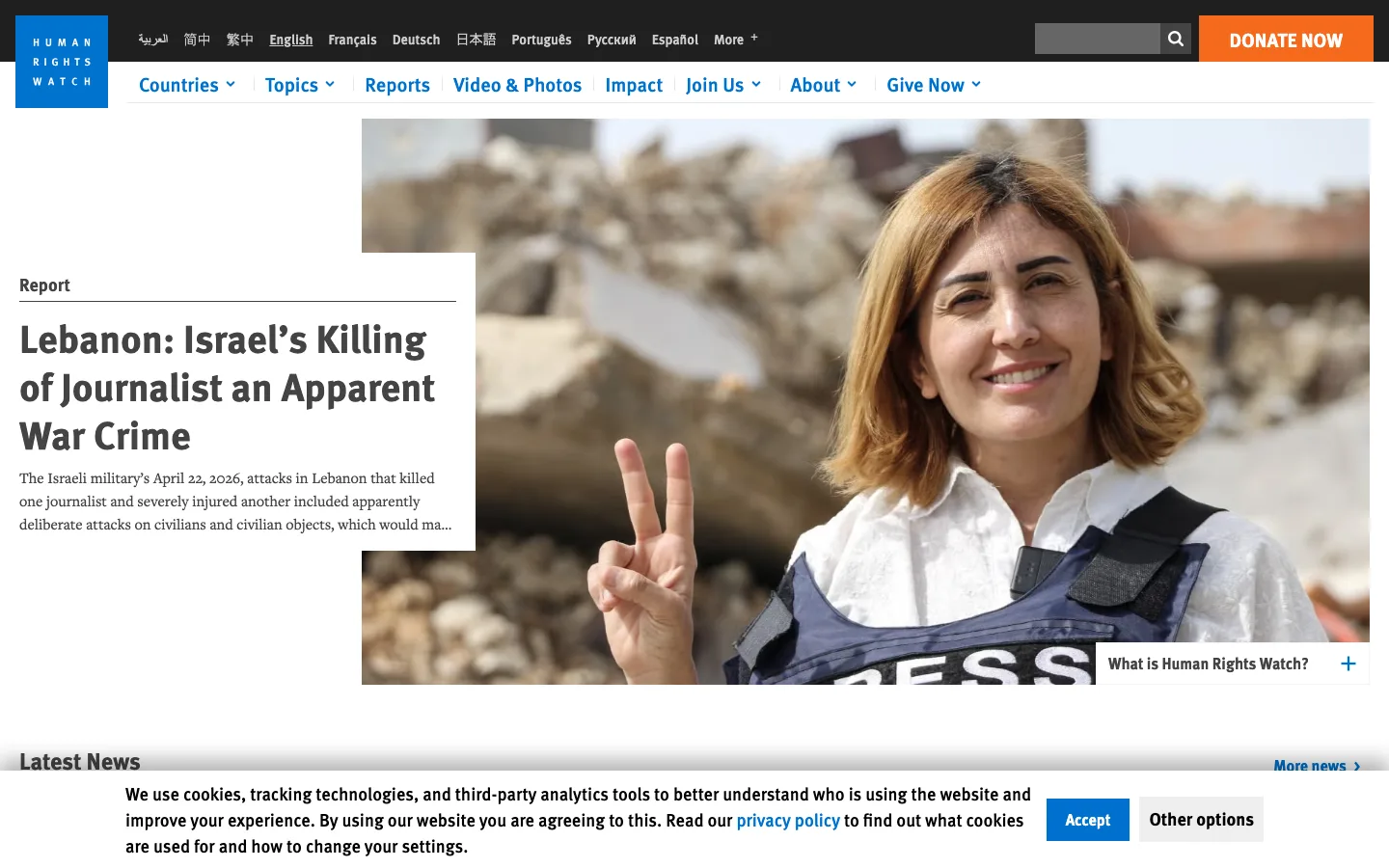 Screenshot of the Human Rights Watch homepage displaying a news report headline and photojournalism image